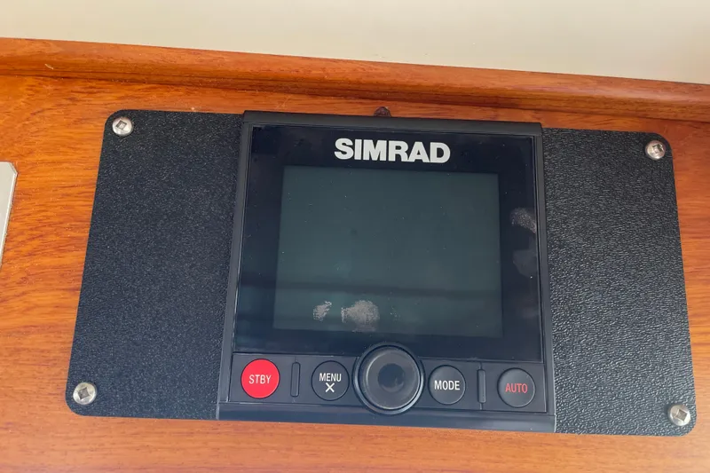 Slide: The Image of Simrad navigation display on 1964 Grand Banks 42 Classic boat dashboard. - 21