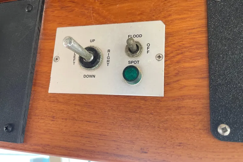 Slide: The Image of Control panel on 1964 Grand Banks 42 Classic boat with switches and indicator light. - 22