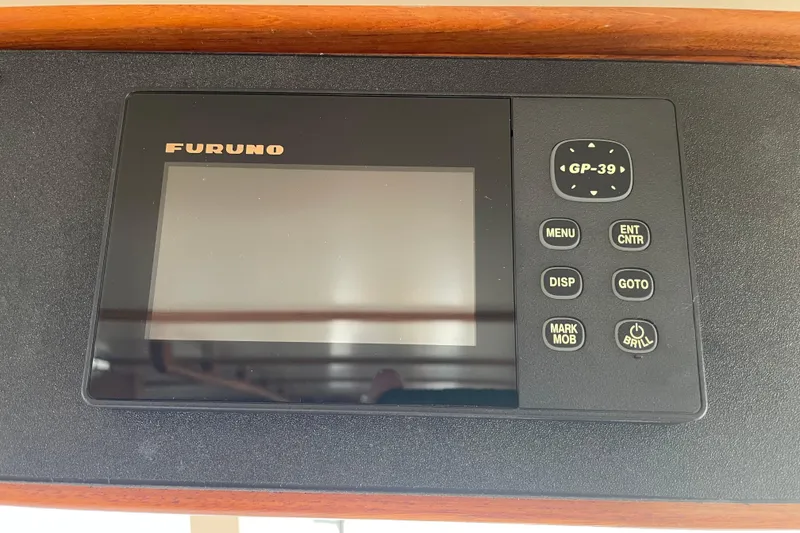 Slide: The Image of Furuno GP-39 navigation device on 1964 Grand Banks 42 Classic yacht dashboard. - 23