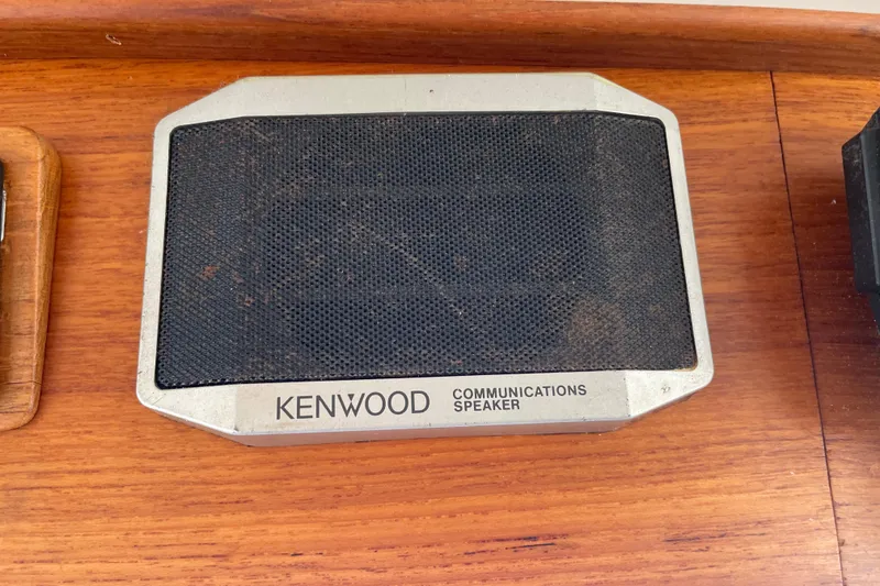 Slide: The Image of Kenwood communications speaker on Grand Banks 42 Classic, 1964, wooden surface. - 29