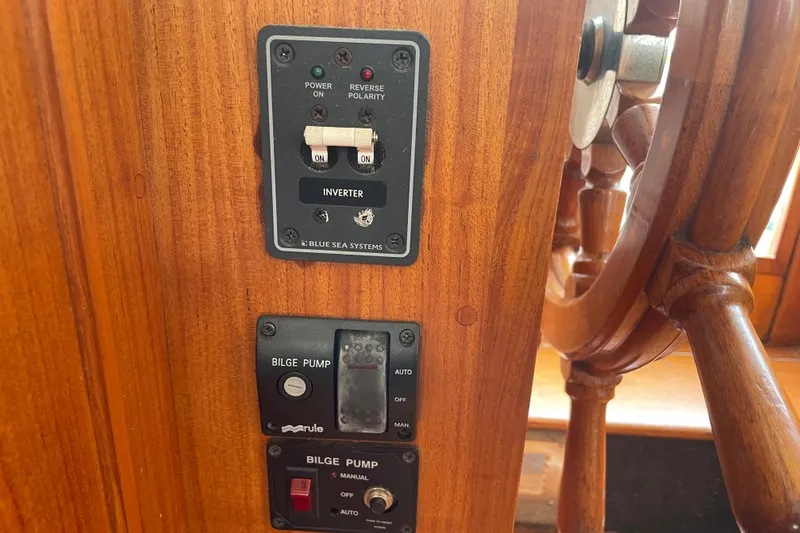Slide: The Image of Control panel on a 1964 Grand Banks 42 Classic boat with inverter and bilge pump switches. - 39