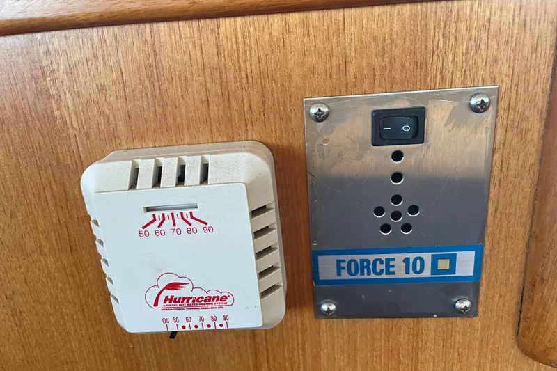 Slide: The Image of Thermostat and control panel on 1964 Grand Banks 42 Classic boat interior. - 40