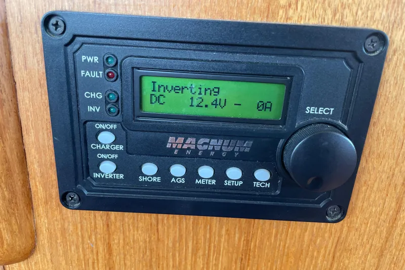 Slide: The Image of Magnum Energy inverter display on 1964 Grand Banks 42 Classic boat, showing 12.4V DC. - 41