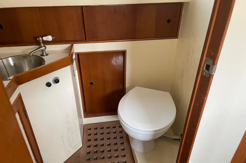 Slide: The Image of Grand Banks 42 Classic 1964 yacht bathroom with sink and toilet. - 56