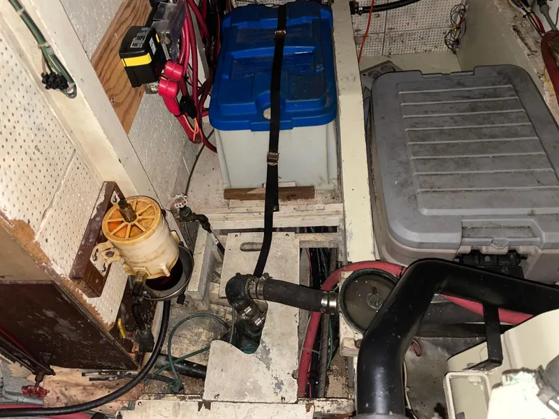 Slide: The Image of Engine room of a 1964 Grand Banks 42 Classic boat, showing battery and wiring. - 69