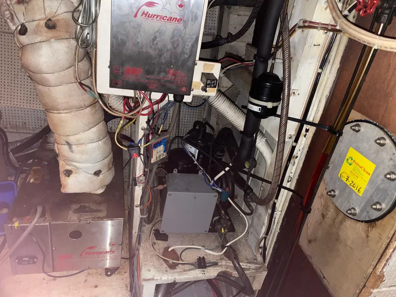 Slide: The Image of Engine room of a 1964 Grand Banks 42 Classic boat with mechanical equipment. - 70