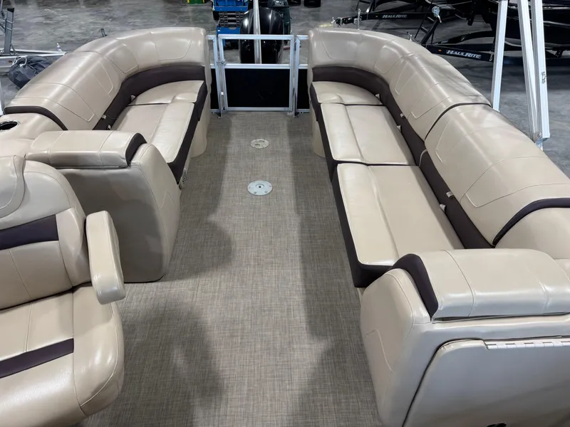 Slide: The Image of 2018 Sun Tracker Party Barge 22 DLX interior with beige seating and spacious layout. - 10