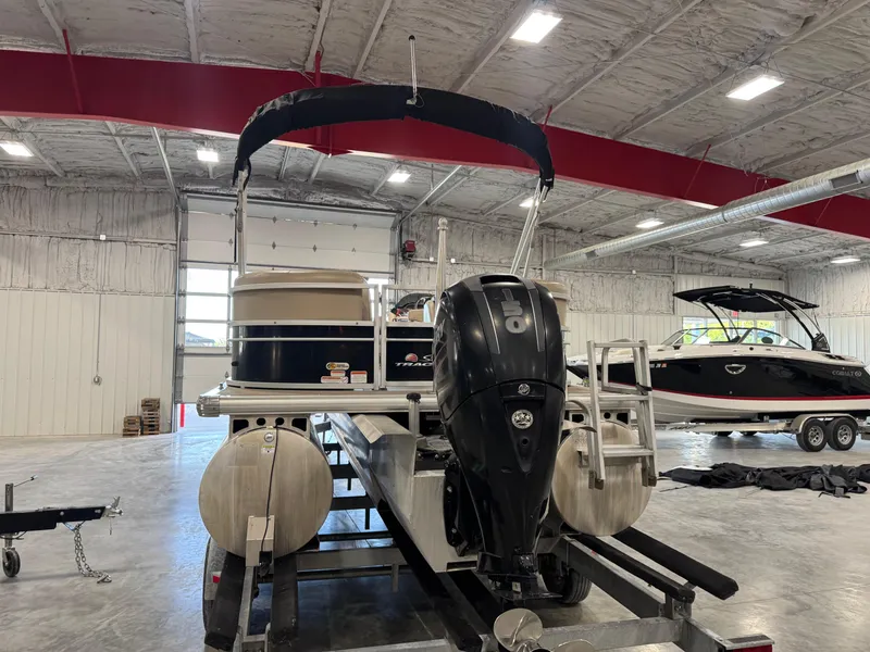 Slide: The Image of 2018 Sun Tracker Party Barge 22 DLX pontoon boat in indoor storage facility. - 13