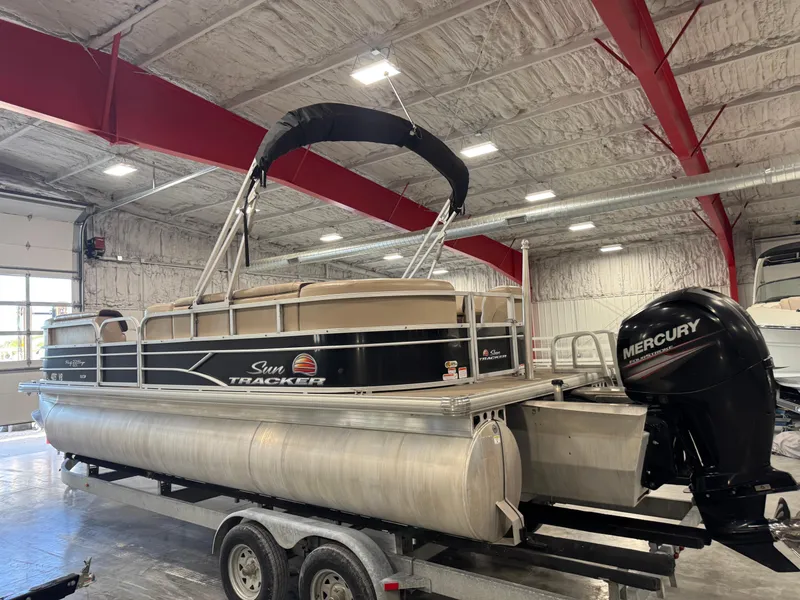 Slide: The Image of 2018 Sun Tracker Party Barge 22 DLX pontoon boat in indoor storage. - 4
