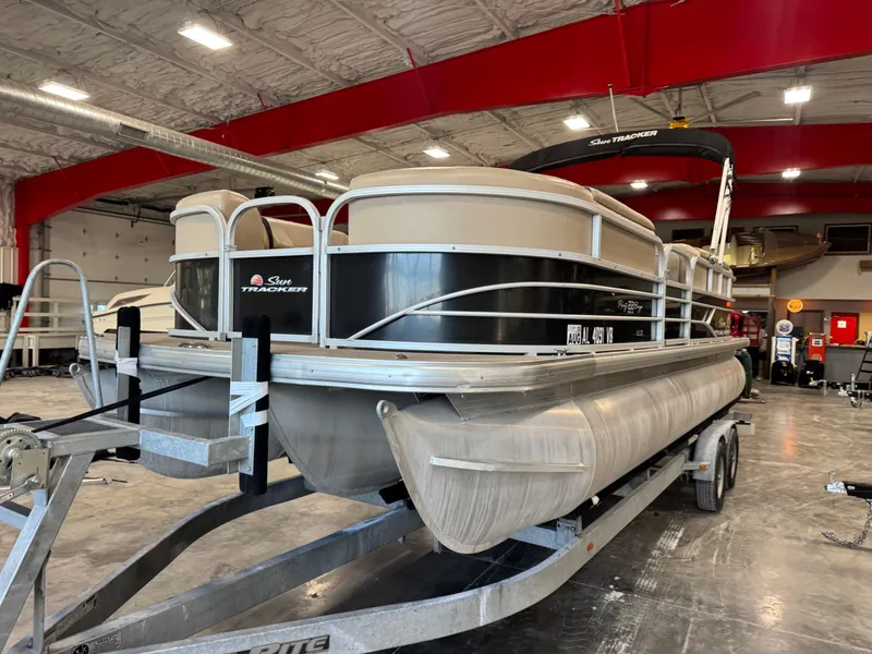 Slide: The Image of 2018 Sun Tracker Party Barge 22 DLX pontoon boat on trailer in indoor storage. - 5