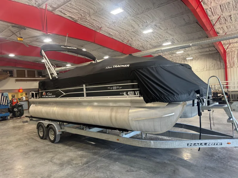 Slide: The Image of 2018 Sun Tracker Party Barge 22 DLX pontoon boat in indoor storage. - 6