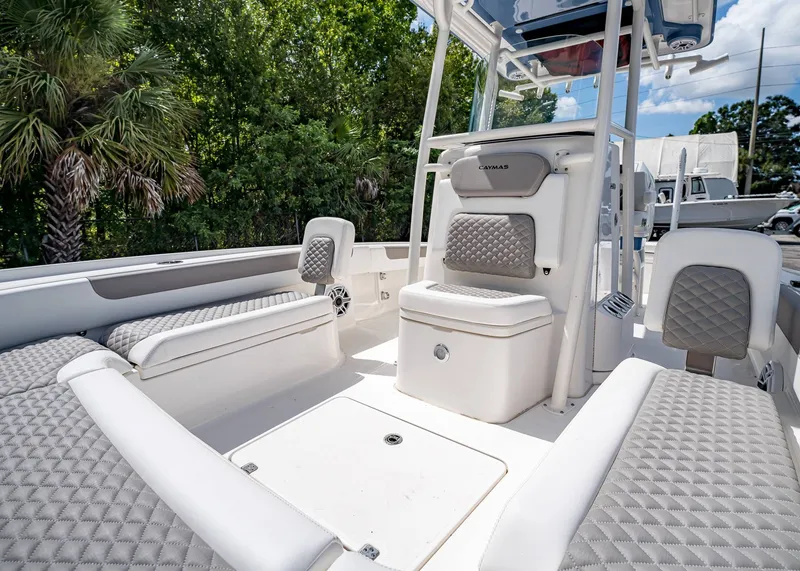 Slide: The Image of 2024 Caymas 26 HB boat interior with cushioned seating and modern design. - 30