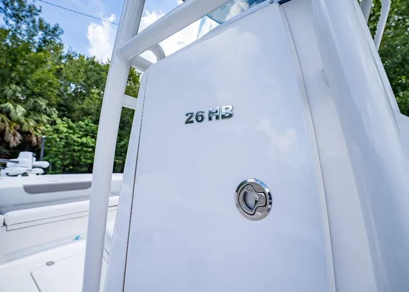 Slide: The Image of 2024 Caymas 26 HB boat detail with sleek white finish and chrome accents. - 32