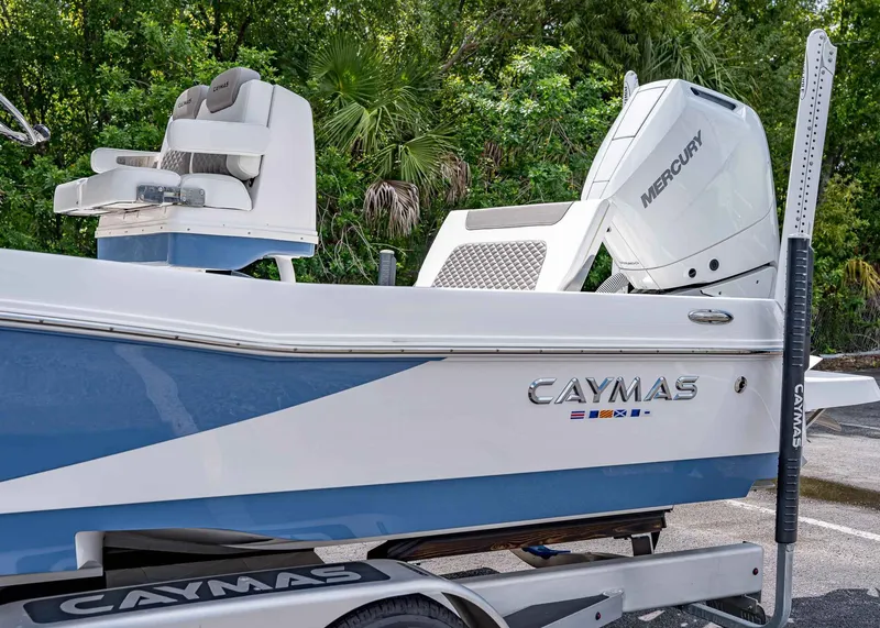 Slide: The Image of 2024 Caymas 26 HB boat with Mercury engine, featuring sleek design and comfortable seating. - 4