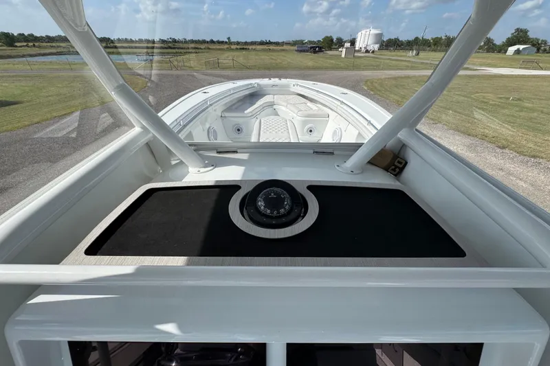 Slide: The Image of 2020 Yellowfin 36 Offshore boat on calm water, aerial view. - 16