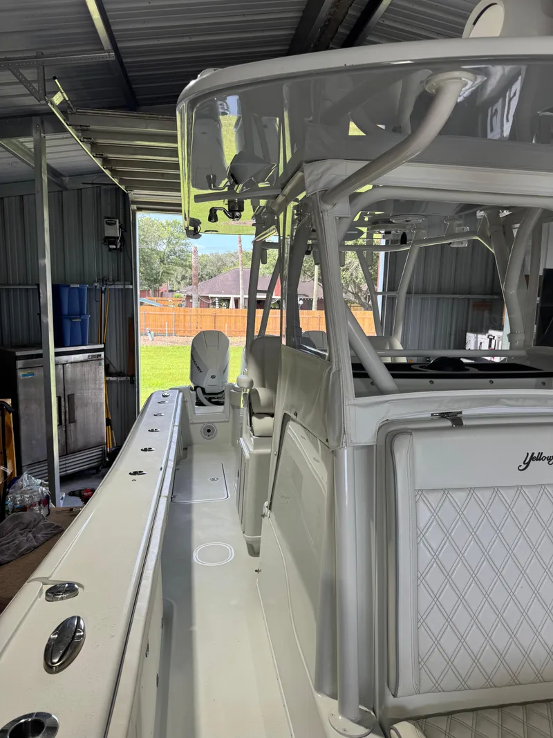 Slide: The Image of 2020 Yellowfin 36 Offshore boat with triple Mercury engines on a trailer. - 21