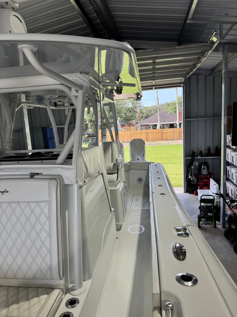 Slide: The Image of 2020 Yellowfin 36 Offshore boat with triple Mercury engines on a trailer. - 22