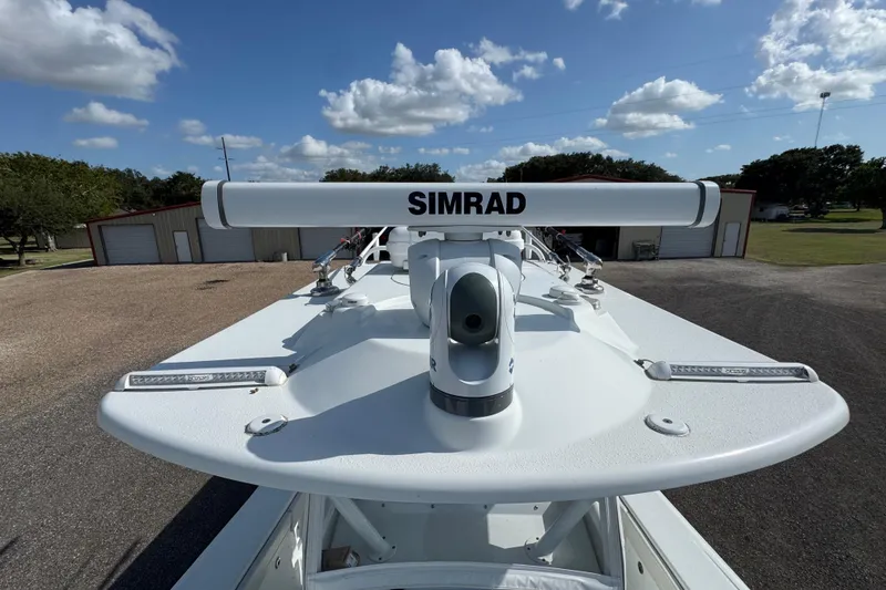 Slide: The Image of 2020 Yellowfin 36 Offshore boat on trailer, parked outside storage units. - 23