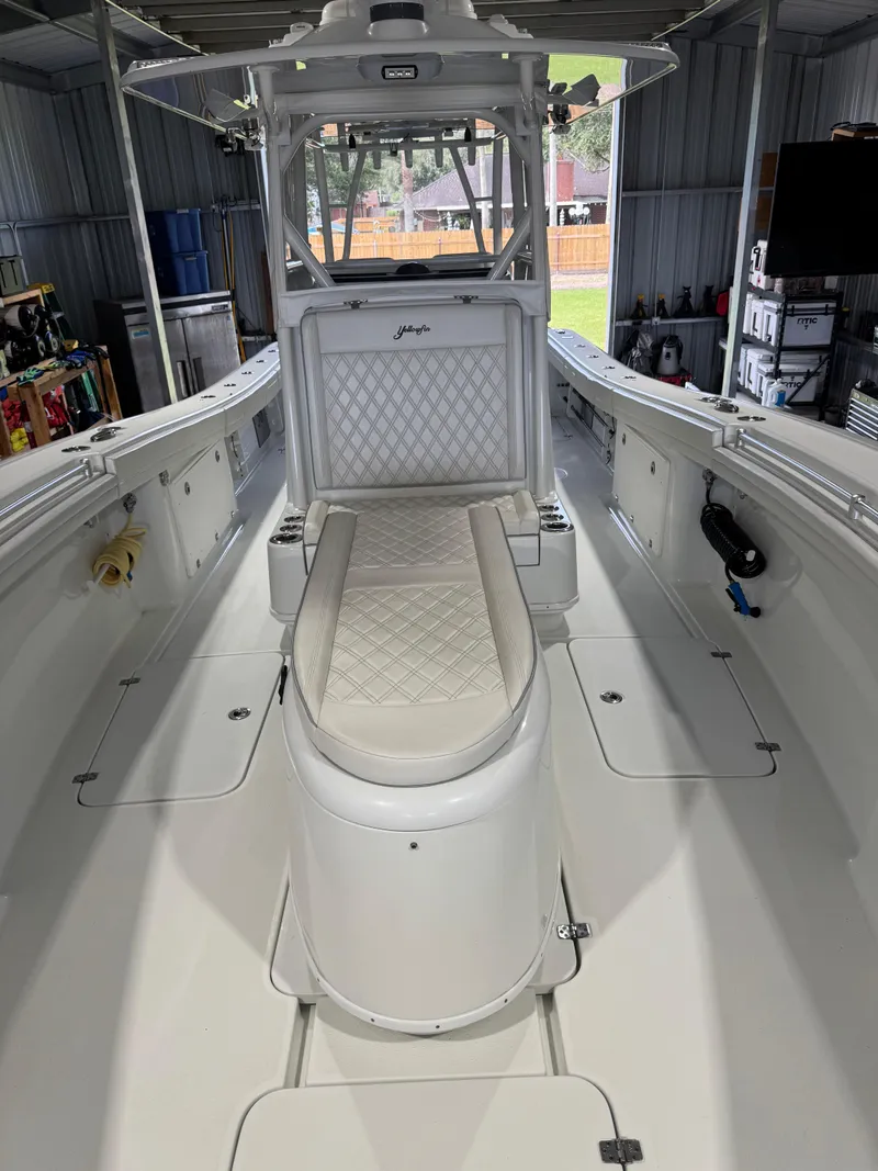 Slide: The Image of 2020 Yellowfin 36 Offshore boat console with dual Simrad displays and steering wheel. - 24