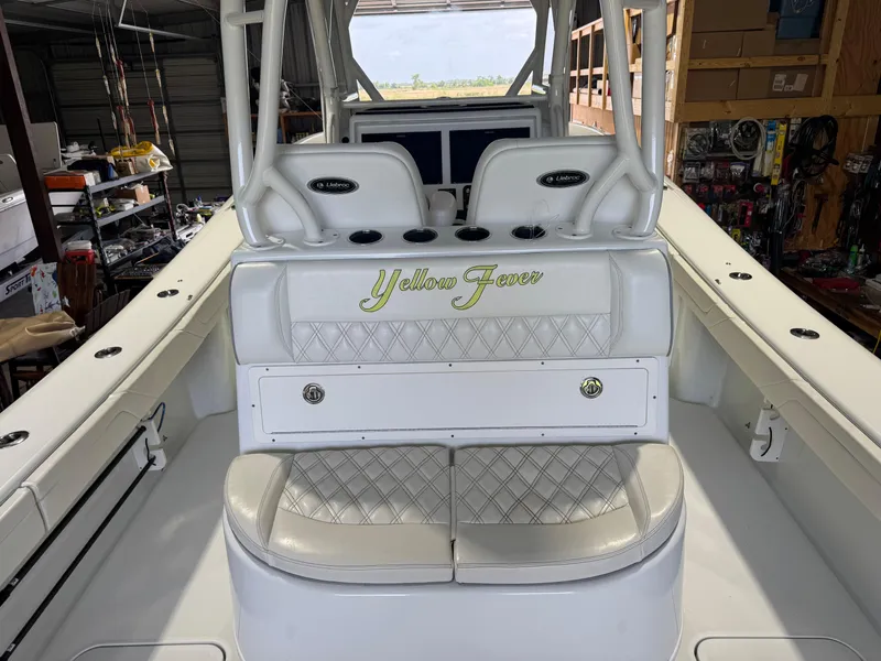 Slide: The Image of 2020 Yellowfin 36 Offshore boat interior with advanced navigation equipment in a storage facility. - 25