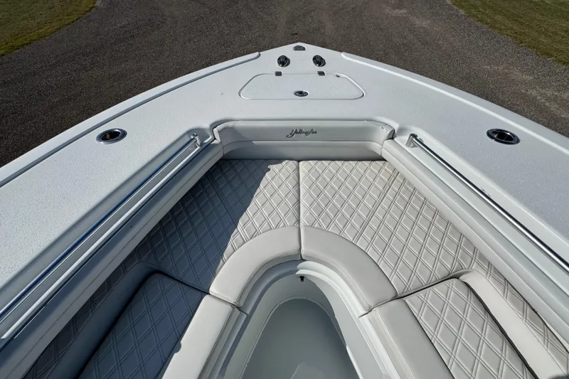 Slide: The Image of 2020 Yellowfin 36 Offshore boat interior with diamond-stitched seating and speakers. - 34