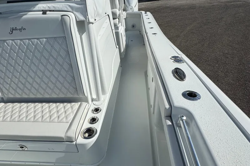 Slide: The Image of 2020 Yellowfin 36 Offshore boat interior with cushioned seating and storage compartments. - 38