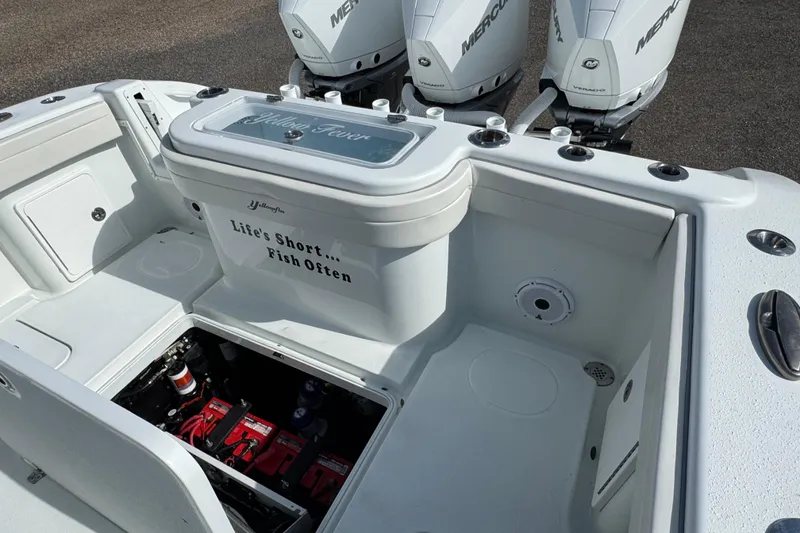 Slide: The Image of 2020 Yellowfin 36 Offshore boat interior with control panel and seating area. - 43