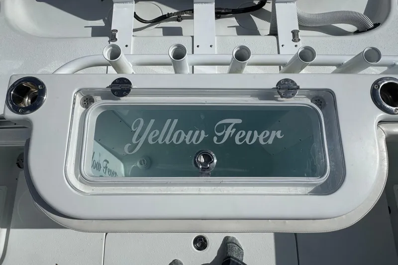 Slide: The Image of 2020 Yellowfin 36 Offshore boat interior with cushioned seating and storage compartments. - 45