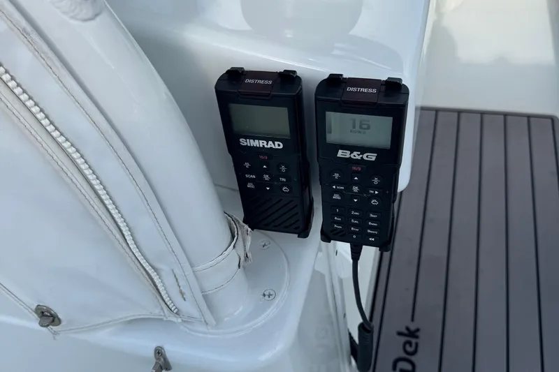Slide: The Image of Two marine radios on a 2020 Yellowfin 36 Offshore boat. - 66