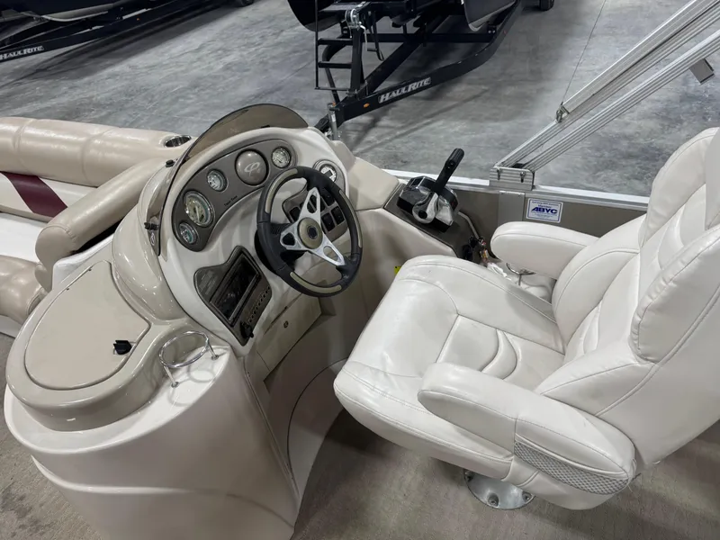 Slide: The Image of 2008 Crest III 2570 boat interior with steering console and white captain's chair. - 13
