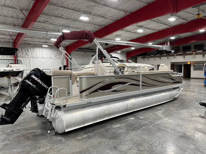 Slide: The Image of 2008 Crest III 2570 pontoon boat with Mercury outboard in a spacious indoor showroom. - 3