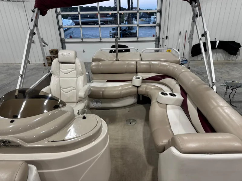 Slide: The Image of Interior of 2008 Crest III 2570 pontoon boat with beige seating and helm. - 7