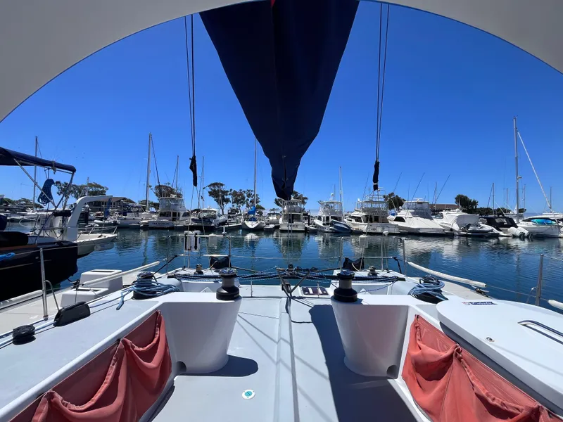 Slide: The Image of Sailboat docked in marina, Class 40 Antrim Design, 2009, with clear blue sky. - 14