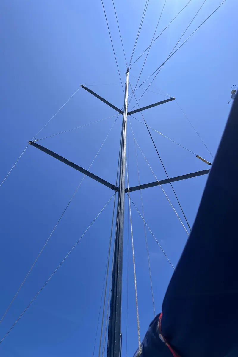 Slide: The Image of Sailboat mast against clear blue sky, Class 40 Antrim Design, 2009 model. - 17