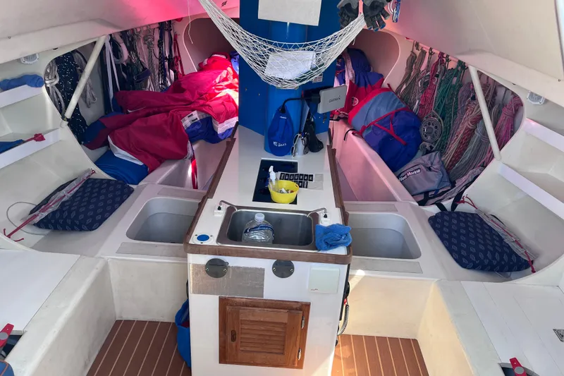 Slide: The Image of Interior of 2009 Class 40 Antrim Design sailboat with compact kitchen and storage. - 21