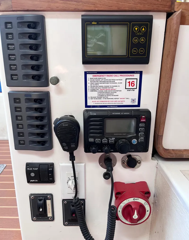 Slide: The Image of Control panel of a 2009 Class 40 Antrim Design boat with radio and switches. - 22