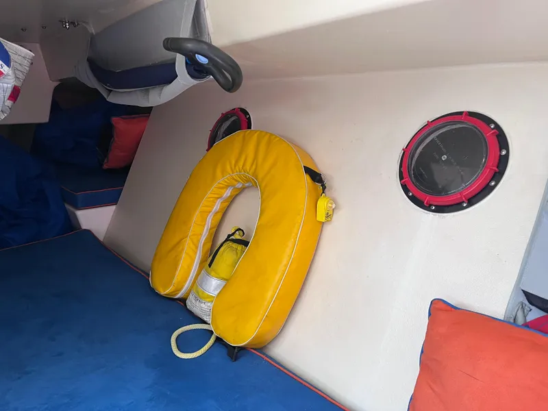 Slide: The Image of Interior of 2009 Class 40 Antrim Design boat with life preserver and colorful cushions. - 29