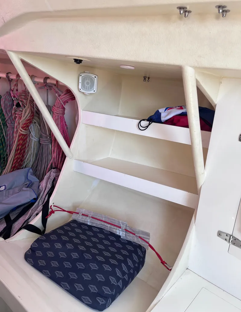 Slide: The Image of Interior of 2009 Class 40 Antrim Design boat with storage shelves and nautical gear. - 31