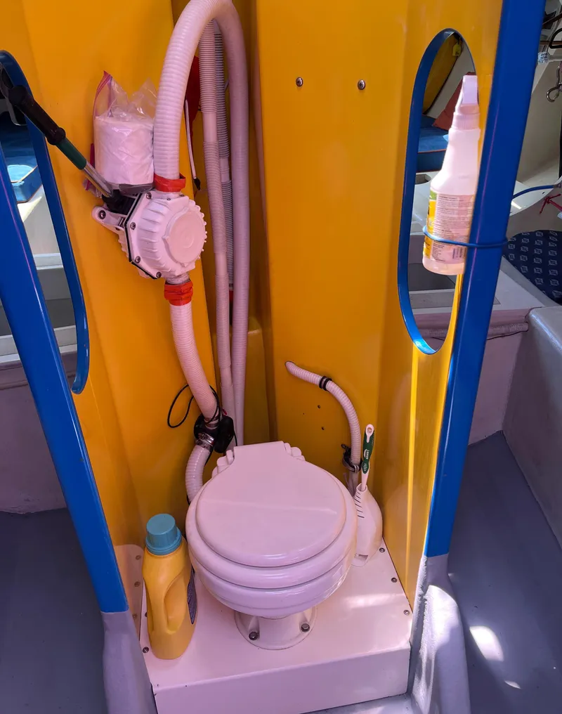 Slide: The Image of Compact marine toilet setup on a Class 40 Antrim Design boat, 2009 model. - 32