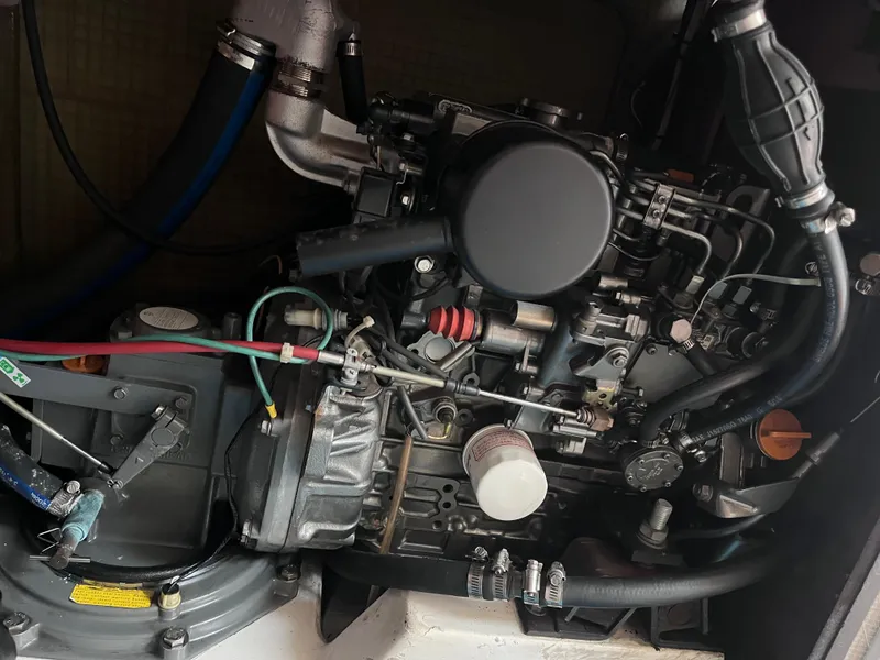 Slide: The Image of Close-up of a 2009 Class 40 Antrim Design engine with visible components and hoses. - 37