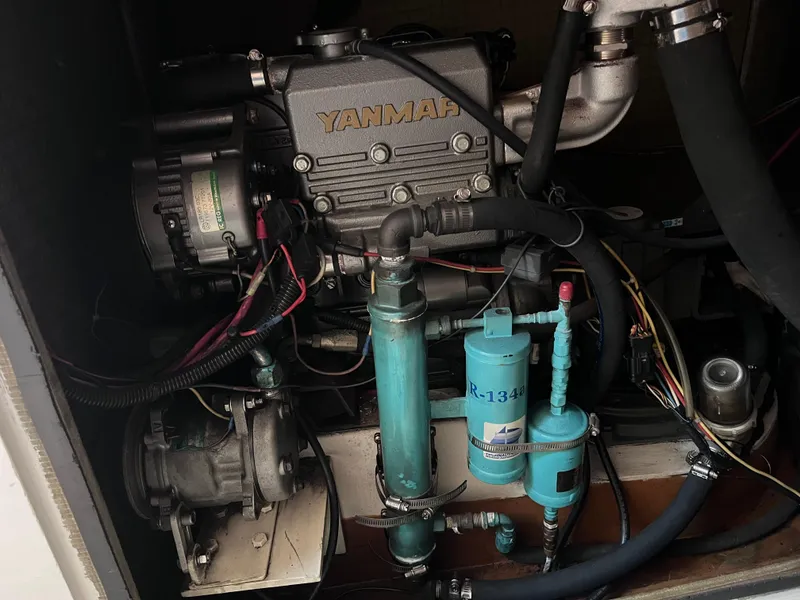 Slide: The Image of Engine compartment of a 2009 Class 40 Antrim Design boat, featuring a Yanmar engine. - 38