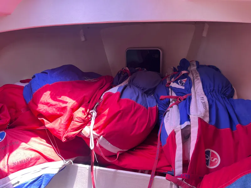Slide: The Image of Sailboat interior with colorful sails stored, Class 40 Antrim Design, 2009 model. - 39