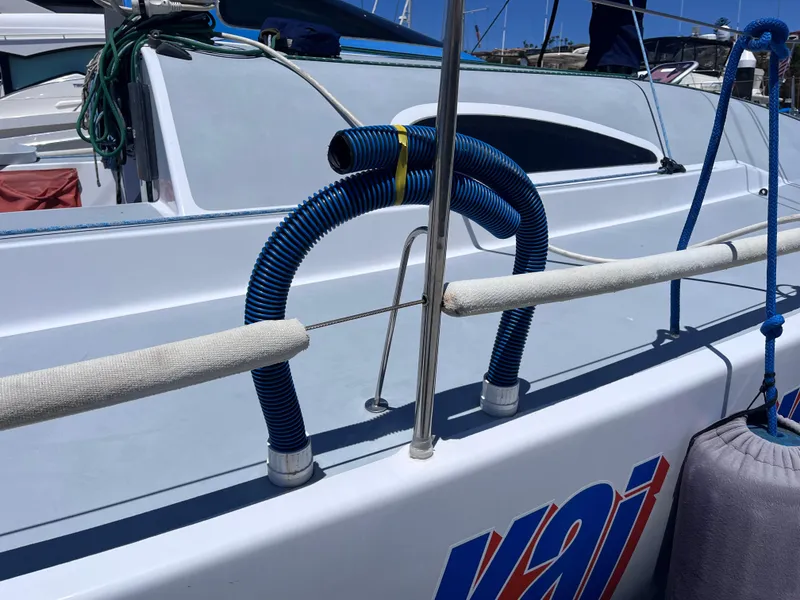 Slide: The Image of Sailboat deck with blue hoses, Class 40 Antrim Design, 2009 model. - 47