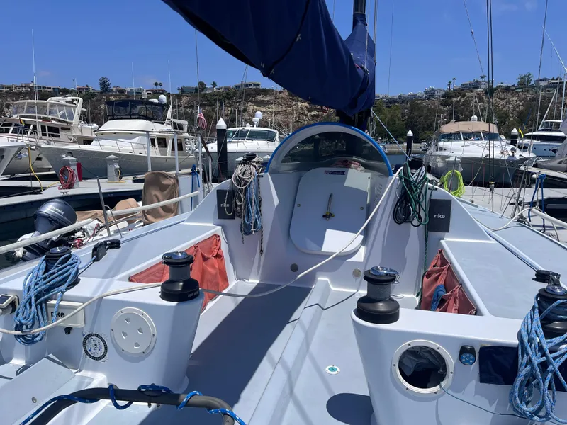 Slide: The Image of Sailboat cockpit of 2009 Class 40 Antrim Design, docked in a marina under clear skies. - 9
