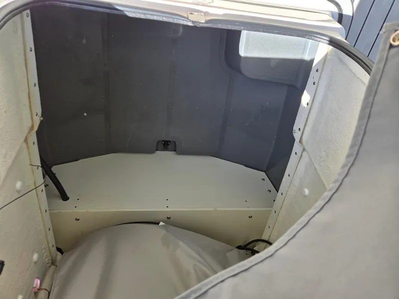 Slide: The Image of Interior storage compartment of 2022 Yamaha Boats 210 FSH Deluxe. - 9