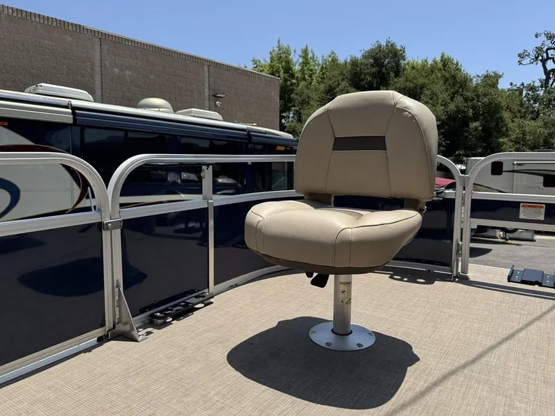 Slide: The Image of 2023 Sun Tracker Bass Buggy 16 XL Select boat seat on deck, outdoors. - 15