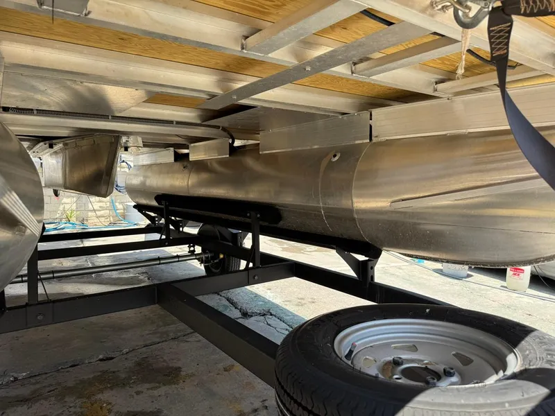Slide: The Image of Underneath view of 2023 Sun Tracker Bass Buggy 16 XL Select pontoon boat on trailer. - 22