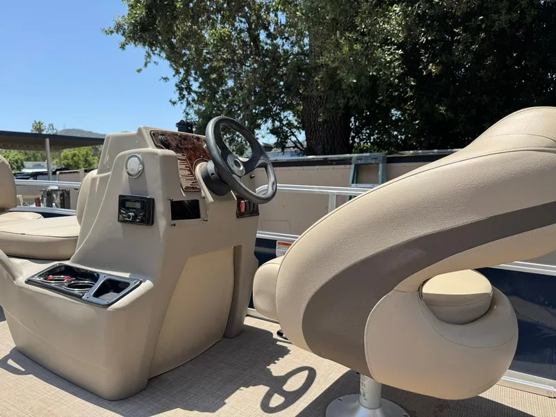 Slide: The Image of 2023 Sun Tracker Bass Buggy 16 XL Select interior with steering console and seating. - 9