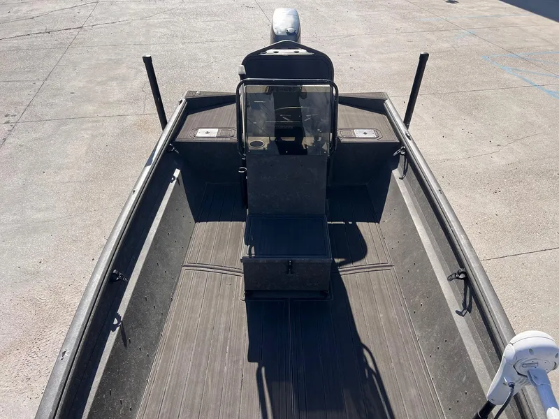 Slide: The Image of 2007 Lakesport 1860 boat interior with steering console and seating, viewed from above. - 10