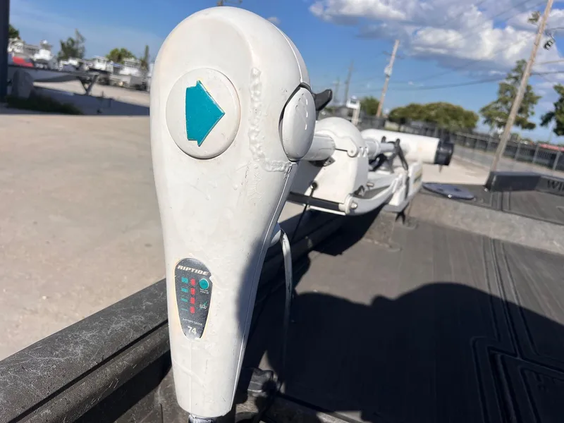 Slide: The Image of Close-up of a 2007 Lakesport 1860 boat control lever under a clear sky. - 11